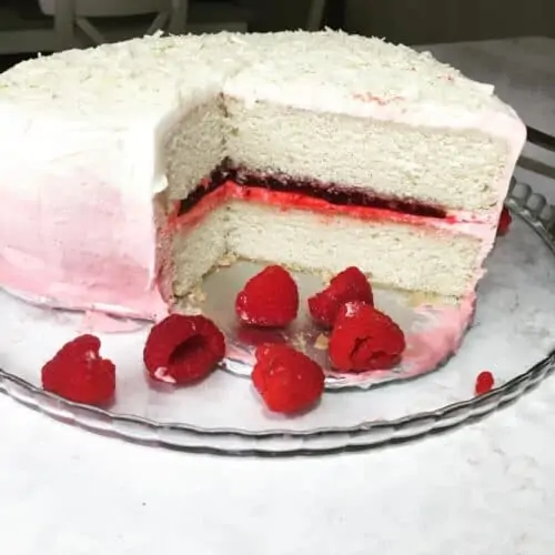 White Layer Cake with Raspberry Filling and Cream Cheese Ombre Frosting